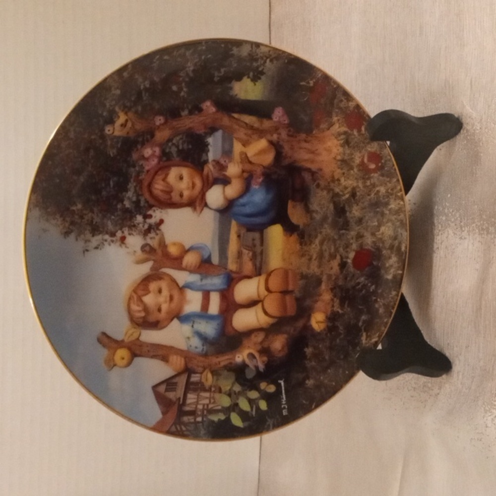 M.J. Hummel "Apple Tree Boy and Girl" collector's plate with stand.